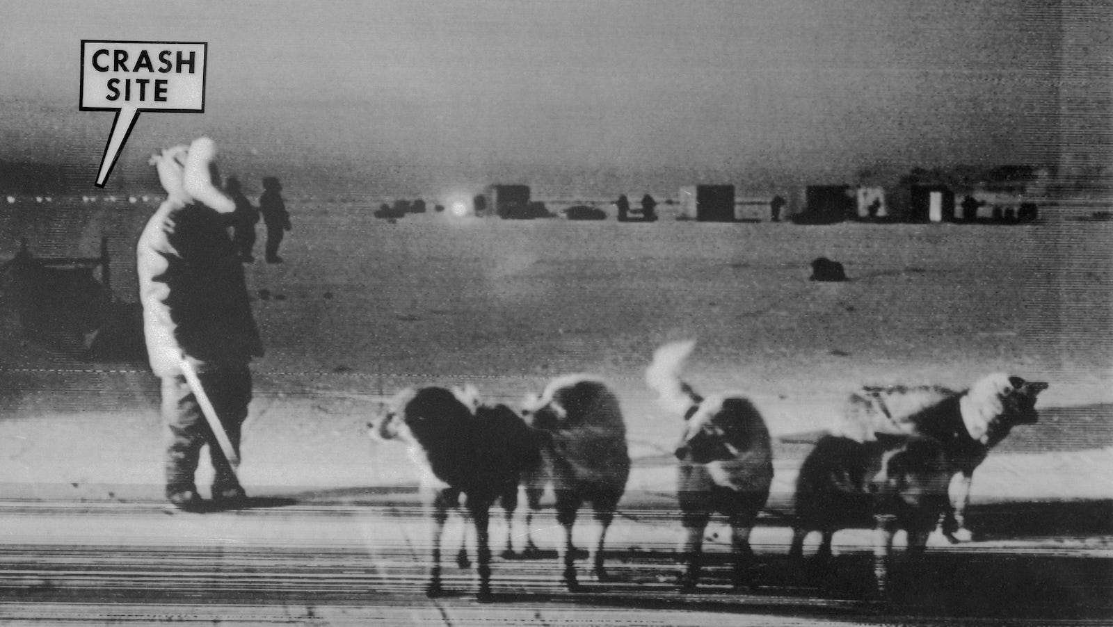An Inuit dog team stands on frozen Baffin Bay near site of crash of a U.S. B52 nuclear bomber on January 21, 1968.
