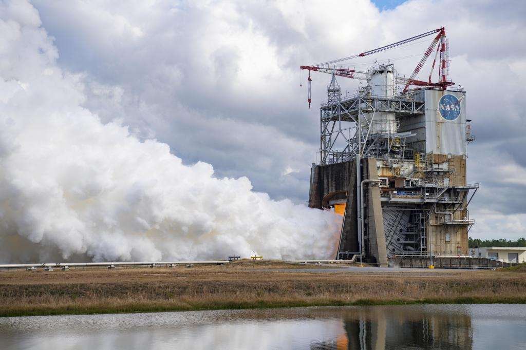 a closer look at vapor clouds escaping towards the sky during hot fire on the Fred Haise Test Stand
