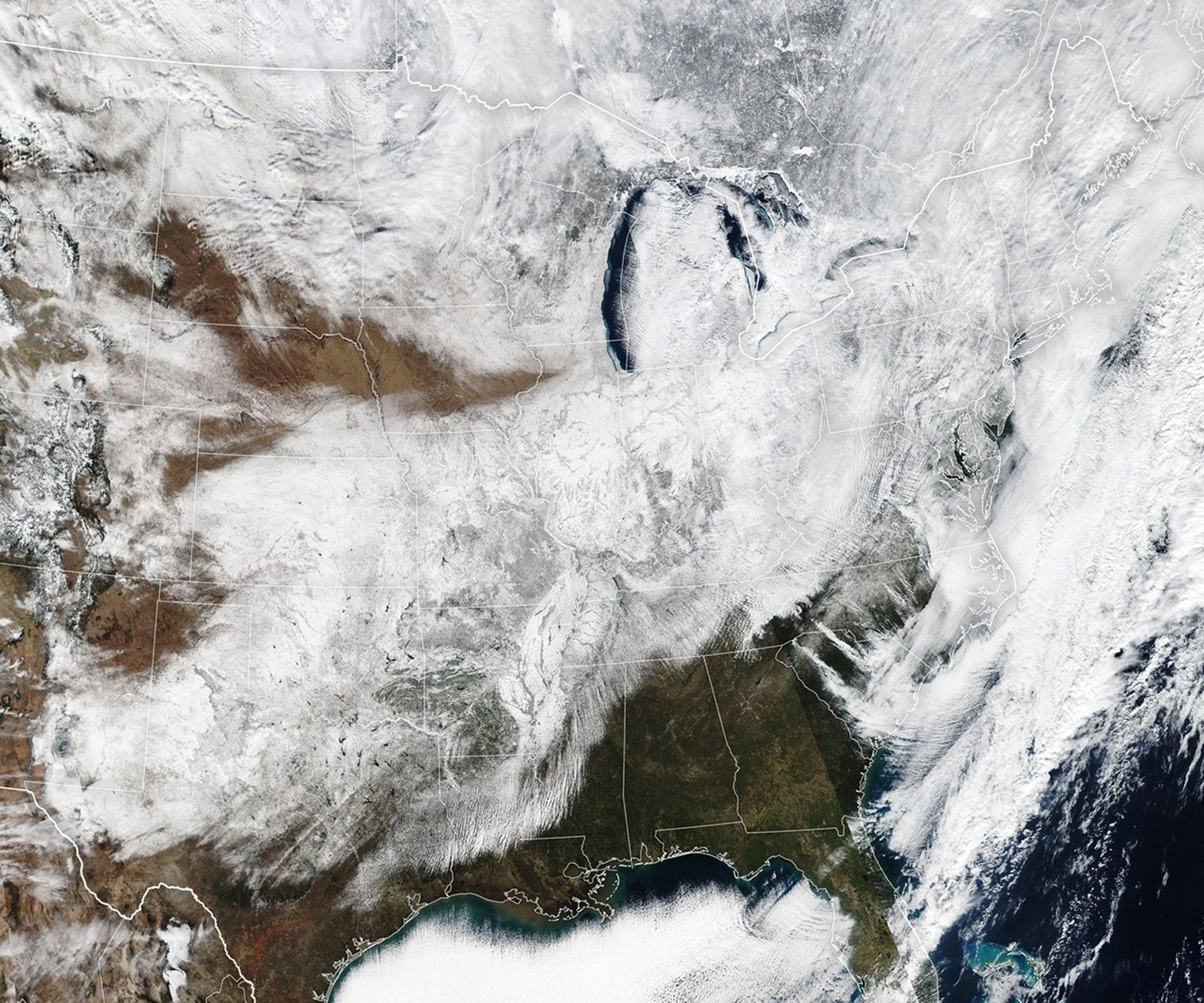 Much of the central, Midwest, and northeast United States is covered in a layer of white snow.