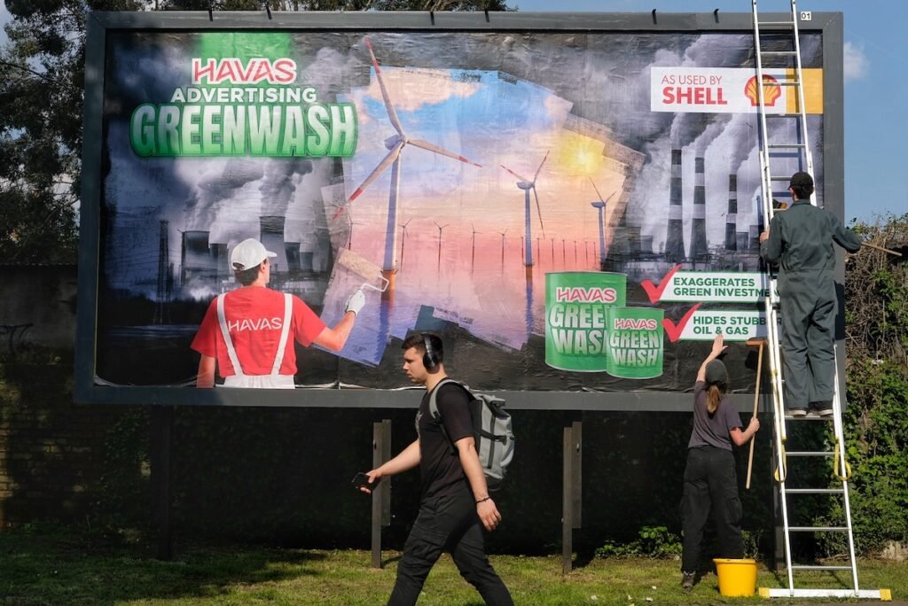 a subvertising billboard aimed at Shell's greenwashing by it's ad agency Havas