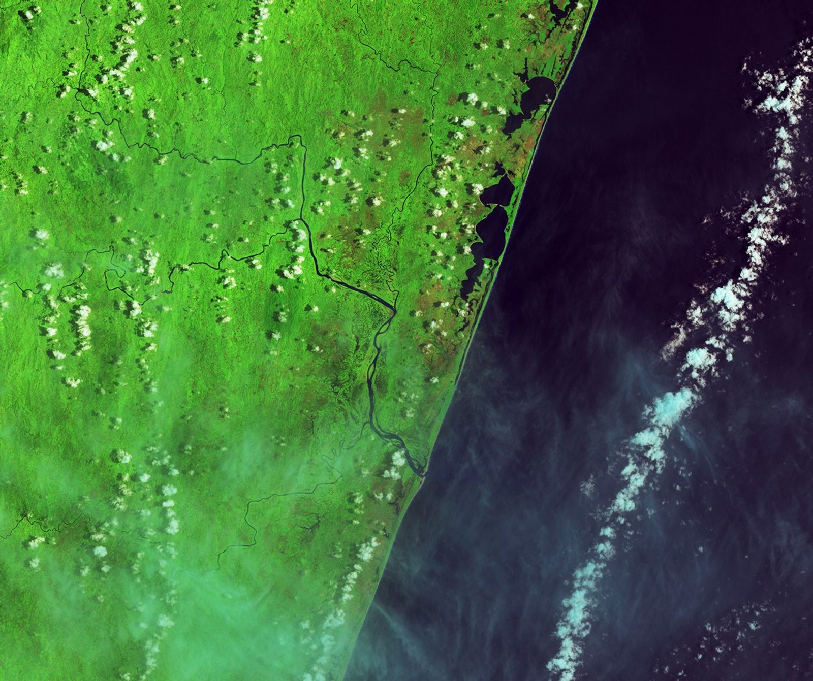 In this false-color image acquired before the flooding, the Rianila and Rongaronga rivers merge near the town of Brickaville. River water appears dark blue against a bright green background of farmland and savanna forest.