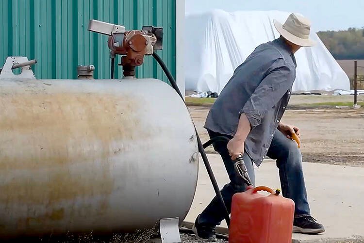 An actor demonstrates how easily someone can steal fuel without being noticed during busy season on the farm during the OPP West Region's Crime Prevention and Community Support Bureau's video discussing various steps rural property owners can take to protect their property as part of the Grey Bruce Farmers Week On-Demand session in early January.  Screengrab Image.