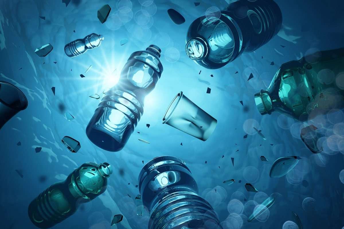 Illustration showing translucent plastic bottles floating in the ocean, backlit by the sky overhead, penetrating the surface of the water