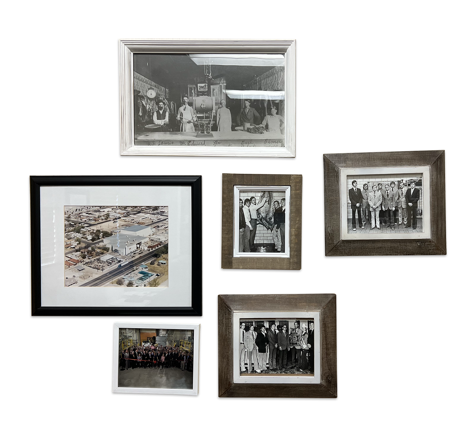 A gallery wall of photographs includes an old photo of men working at a butcher shop, three photos of young Sam Cobb, an aerial photo of the RMS Foods factory, and a photo of the RMS Foods staff.