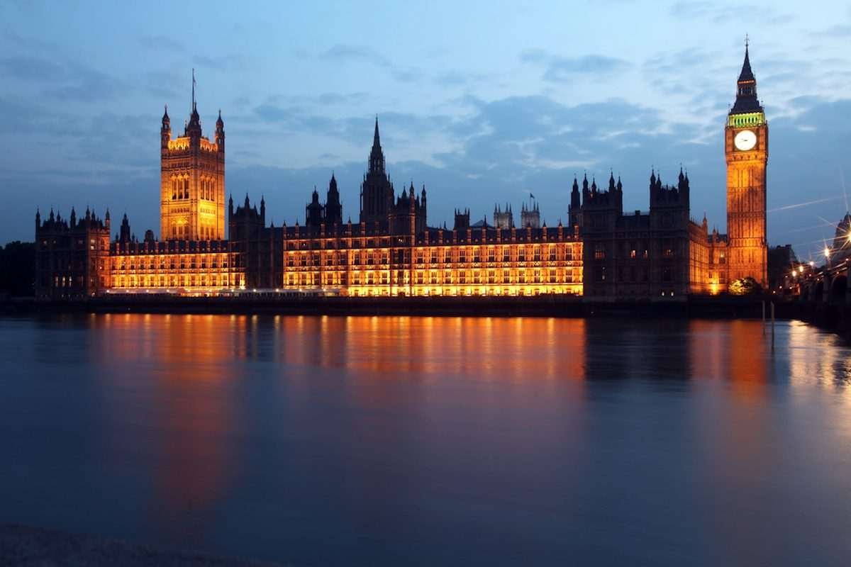 The UK Houses of Parliament, viewed at nighttime, from the oposite bank of the Thames