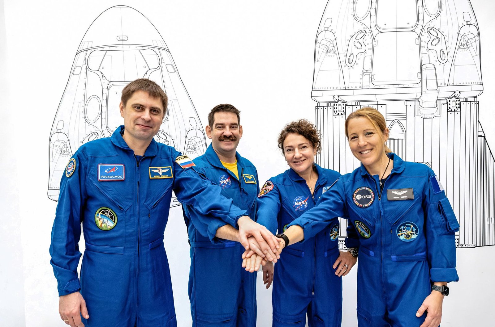 The four members of NASA's SpaceX Crew-12 mission to the International Space Station pose together for a crew portrait in their blue flight suits at SpaceX headquarters in Hawthorne, California. From left are, Roscosmos cosmonaut and Mission Specialist Andrey Fedyaev, NASA astronauts Jack Hathaway and Jessica Meir, Pilot and Commander respectively, and ESA (European Space Agency) astronaut and Mission Specialist Sophie Adenot.