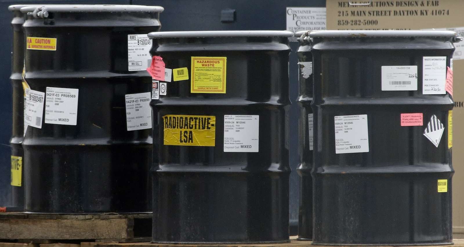 barrels labeled radioactive LSA and hazardous waste