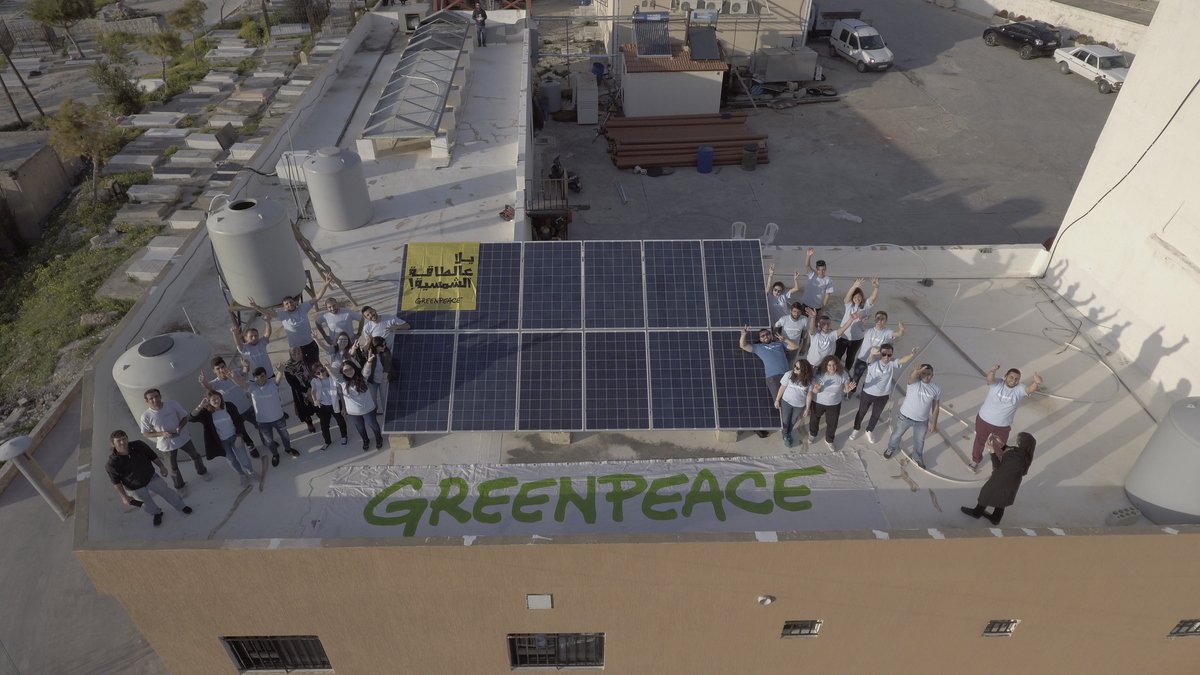Group Photo on the Roof with Solar Installation in Lebanon. © Imad Maalouf / Greenpeace Group Photo on the Roof with Solar Installation in Lebanon. © Imad Maalouf / Greenpeace