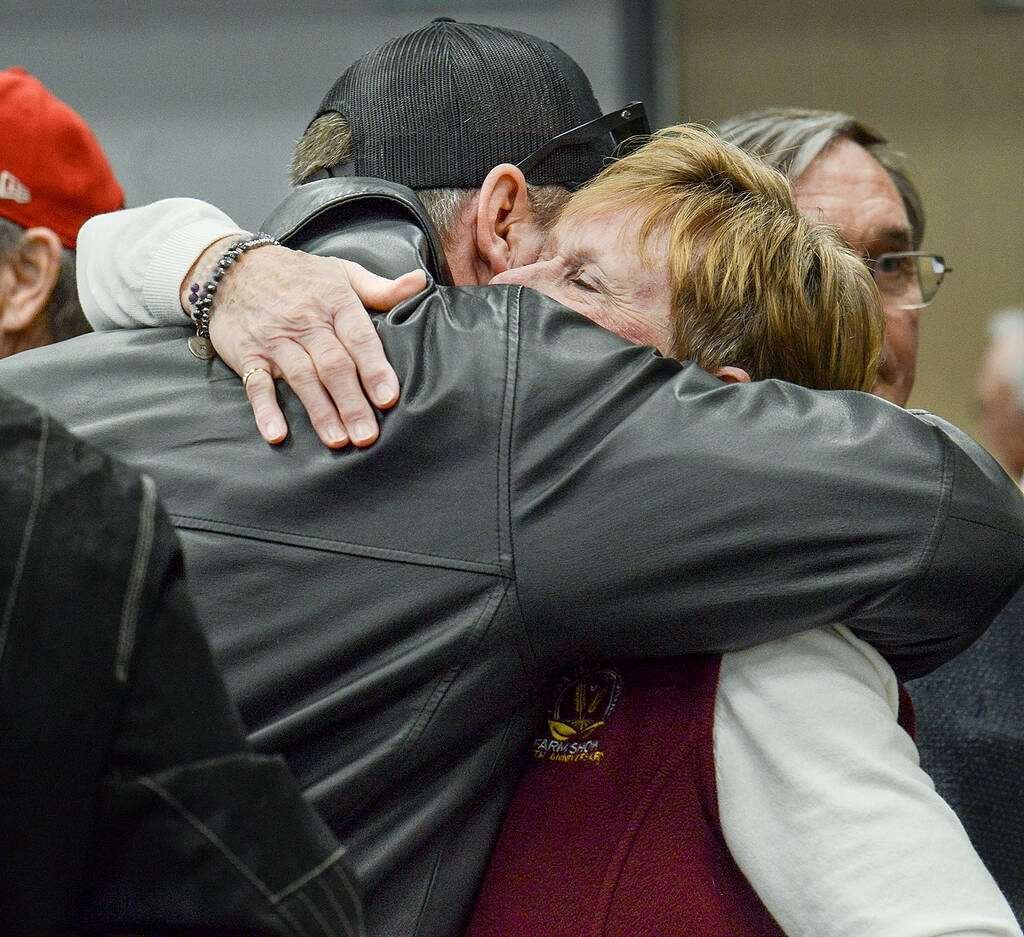 Kathy Hardy, left, winnder of the 2026 Ottawa Valley Seed Growers Association's Award of Excellence, is congratulated by family and friends after the presentation March 11 at the Ottawa Valley Farm Show. Photo: Diana Martin
