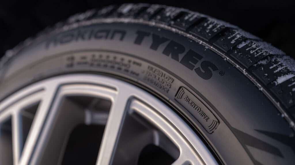 Close up of a Nokian Tyres tire with company branding on the sidewall