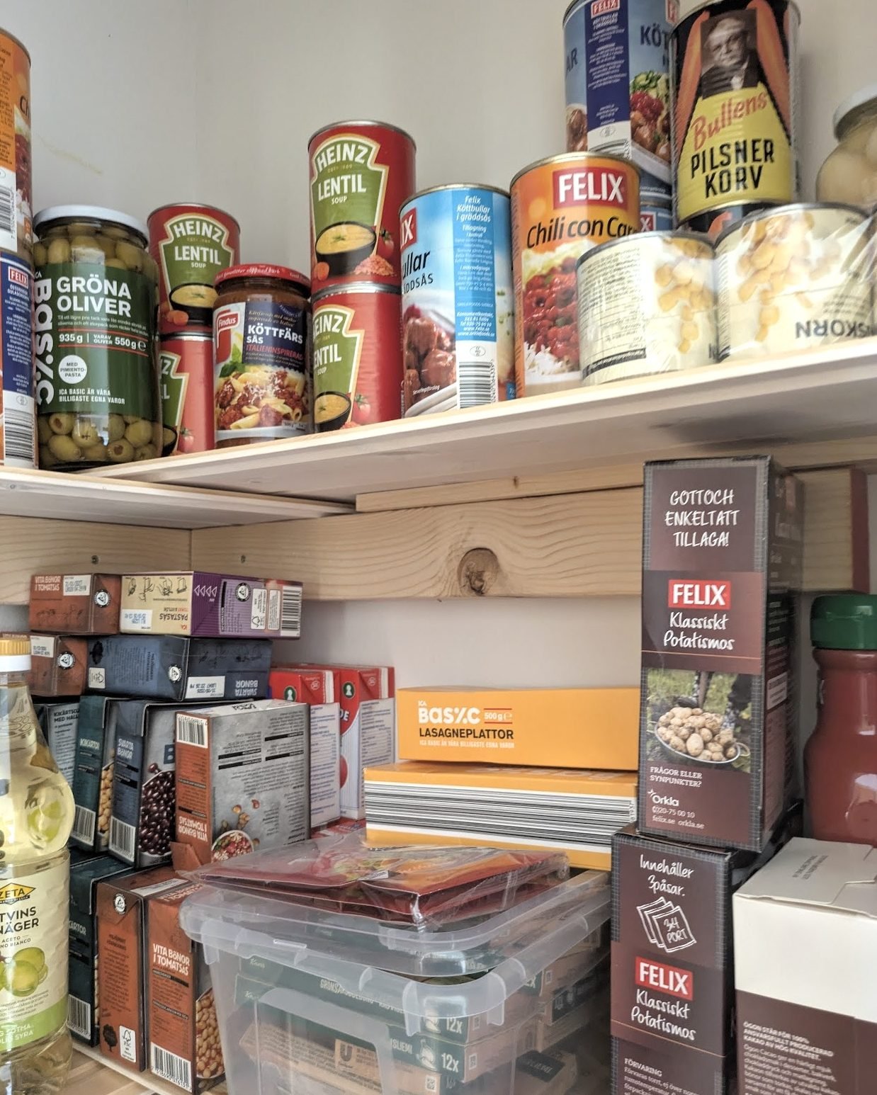 a pantry with lots of canned foods and pasta