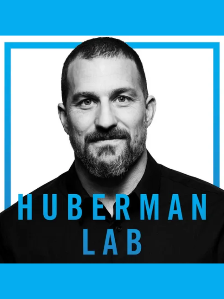 Black and white image of a person with short hair and a beard, wearing a dark shirt. The text reads "Huberman Lab" in bold blue font.