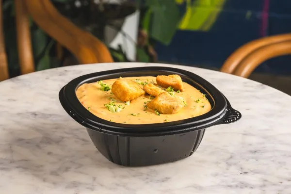 black bowl with chowder in it