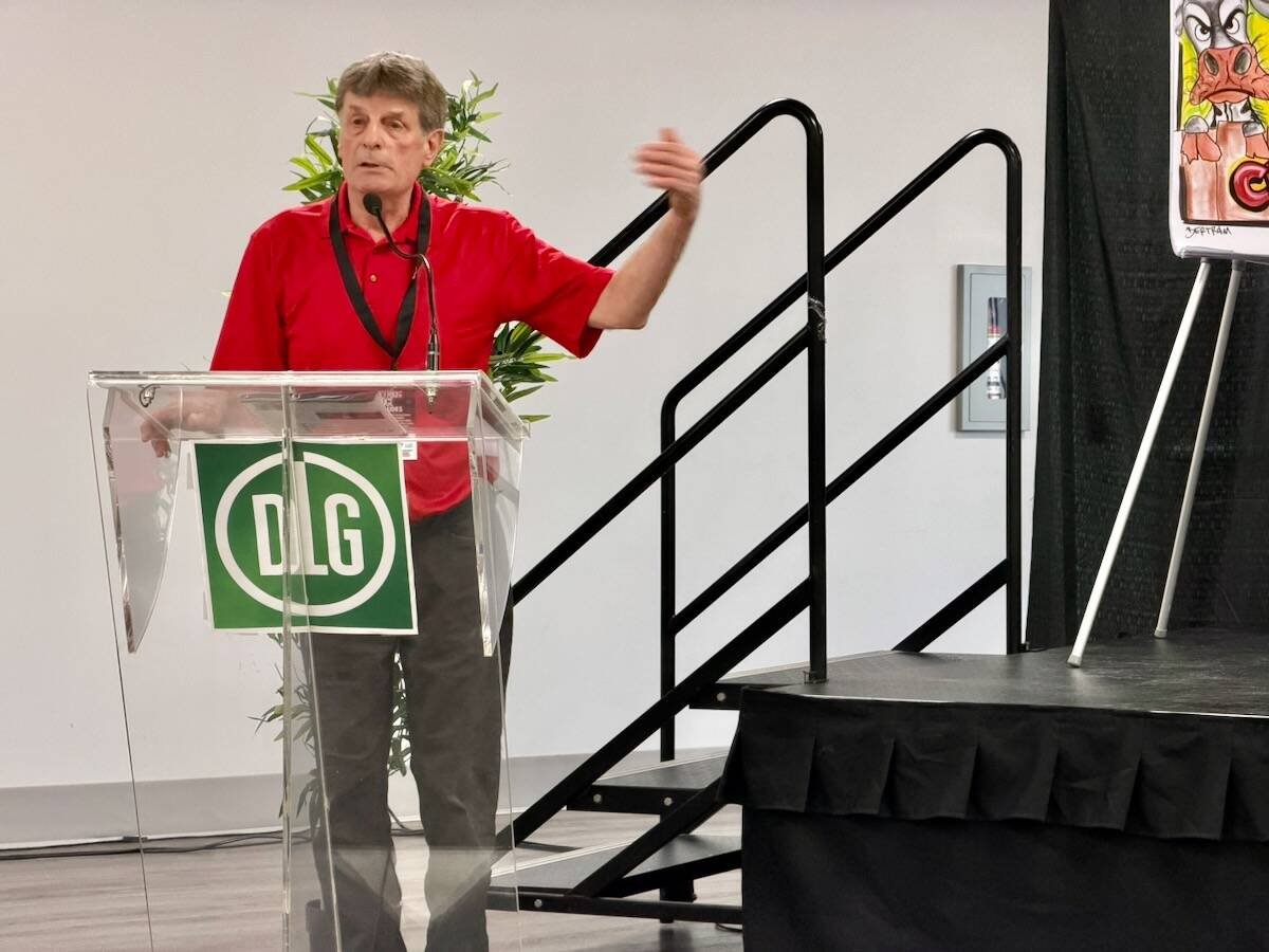 Ontario dairy farmer Clarence Markus speaking at the Canadian Dairy Business Summit 2026. Photo: John Greig.