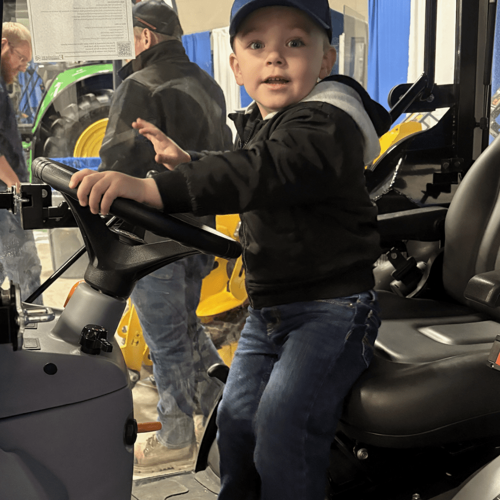 Alexander Duff of Drayton tests out farm machinery at the Equipment Ontario booth at at the 42nd annual Drayton Farm Show. Photo: Sarah McGoldrick 