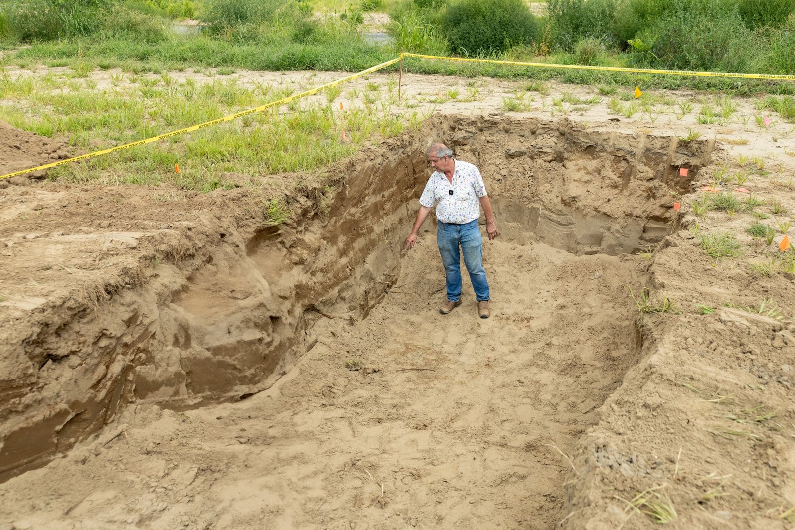 Soil scientist Forbes Walker visits Will Runion's farm in 2025, examining the deep sandy deposits left behind by Hurricane Helene.