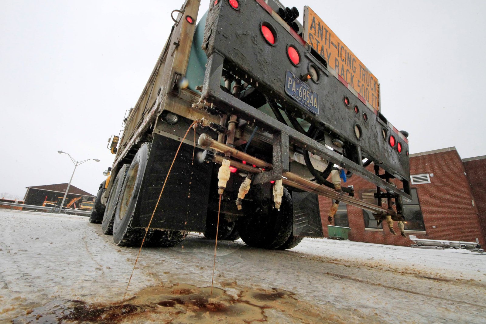Truck spreading brine on Pennsylvania road