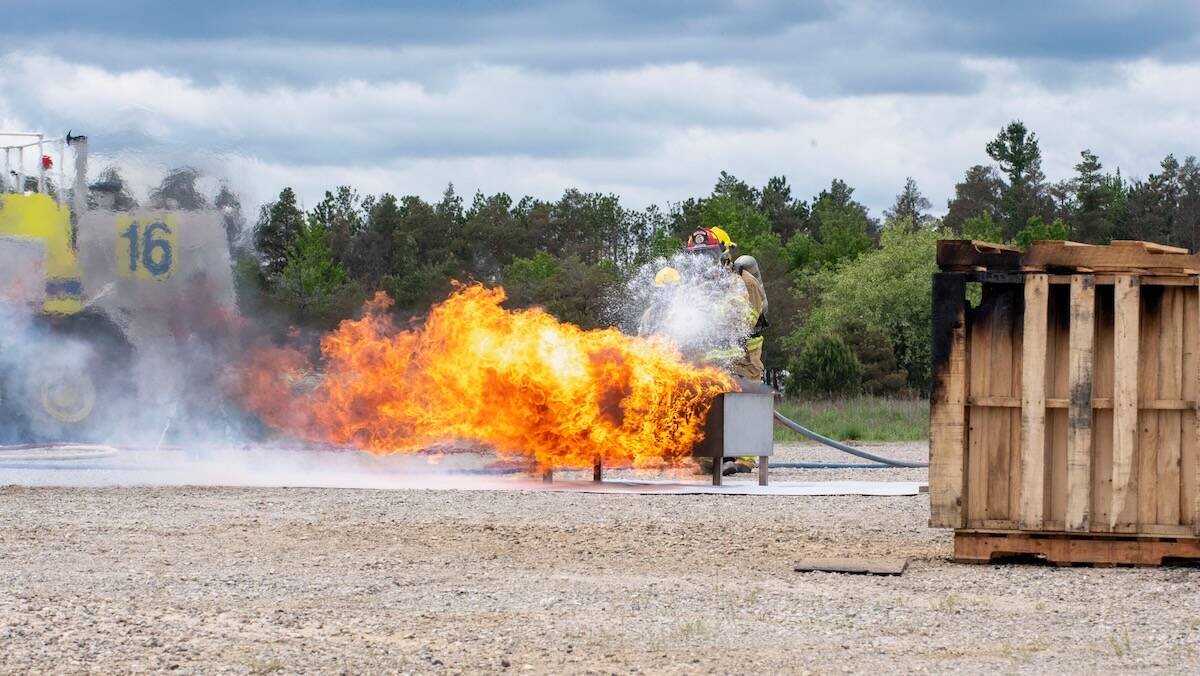 Canadian Armed Forces firefighters from the Canadian Forces Fire and CBRN Academy (CFFCA) alongside personnel from FireRein conducts a demonstration of the efficacy of the FireRein Eco-Gel in stopping and preventing fire in the CFFCA Burn Area at Canadian Forces Base Borden. Photo: Corporal Marco Tijam, Canadian Forces Base Borden, courtesy FireRein