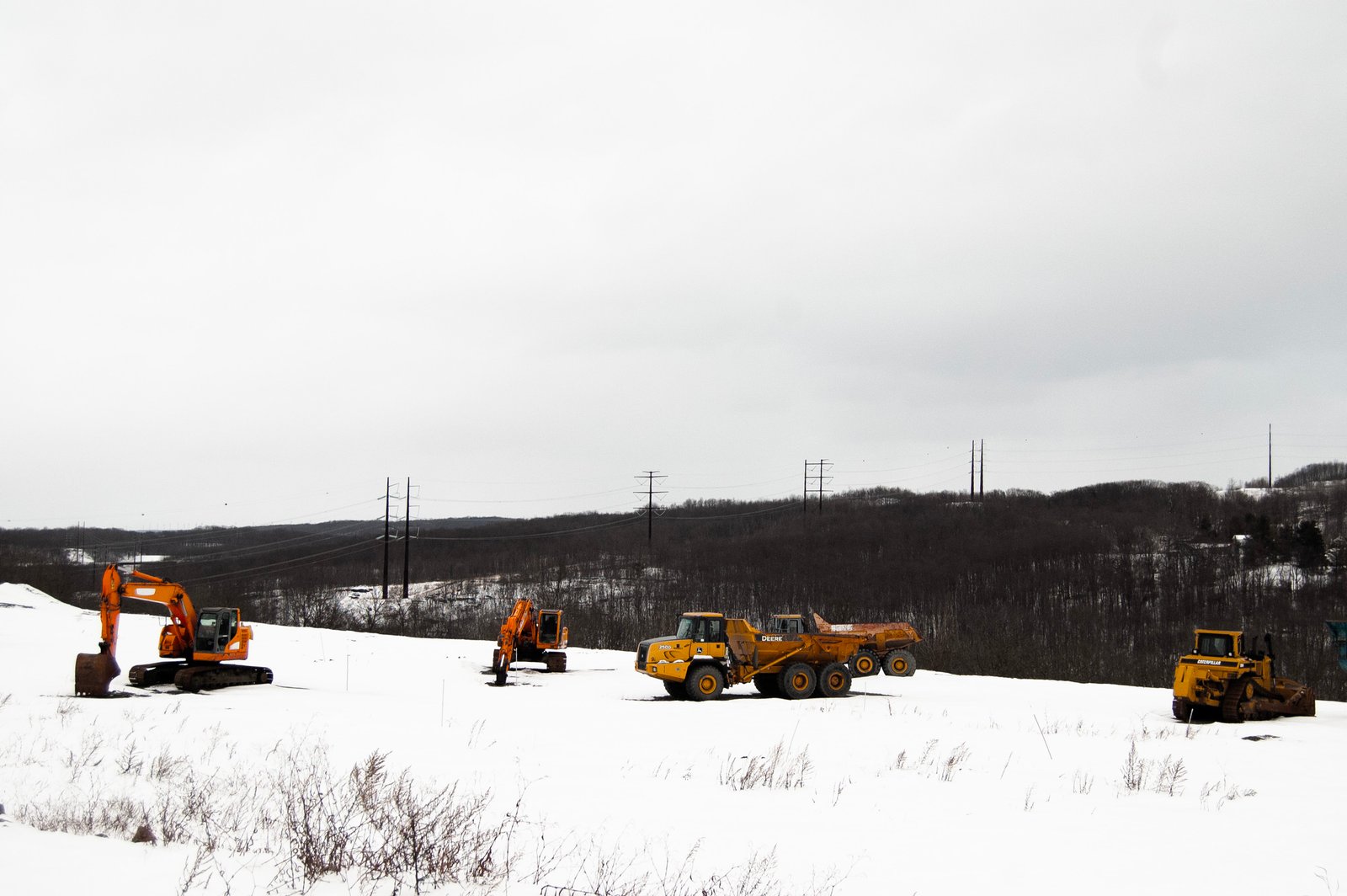 A high-voltage power line runs behind a construction site in Archbald, Pennsylvania.