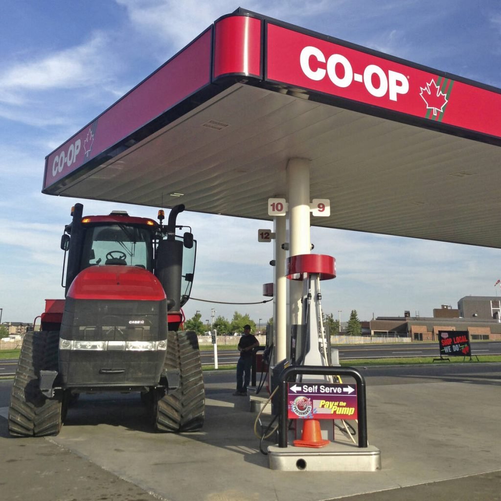 A Case IH tractor fuelling up at a Co-op gas station, illustrating farm fuel costs amid rising diesel prices. Photo: file
