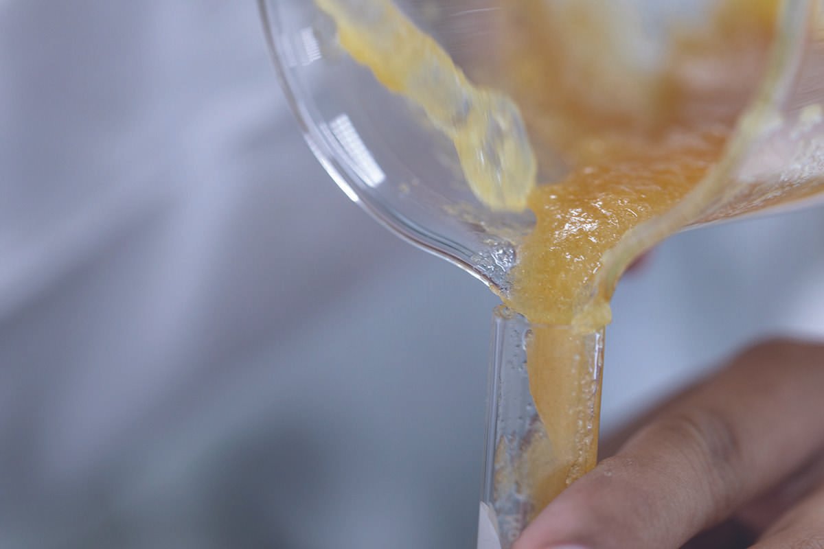 Close-up of polymer-like material being processed in a laboratory experiment,