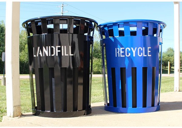 a set of outdoor recycling bins