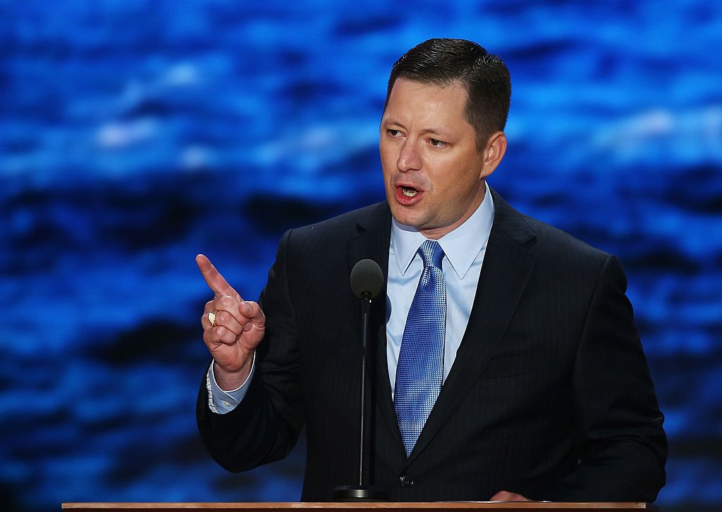 Man speaks at podium