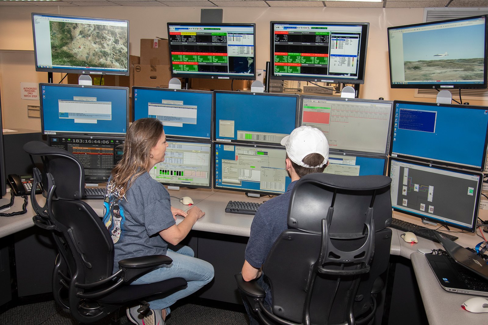 Sonja Belcher and Zach Springer at Telemetry and Radar Acquisition Processing System.