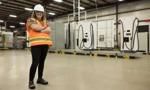 FTI Team Member in front of Excellerate Product