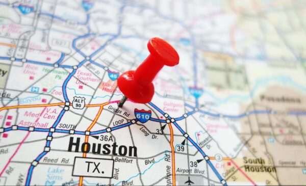 A red pin stuck into a map