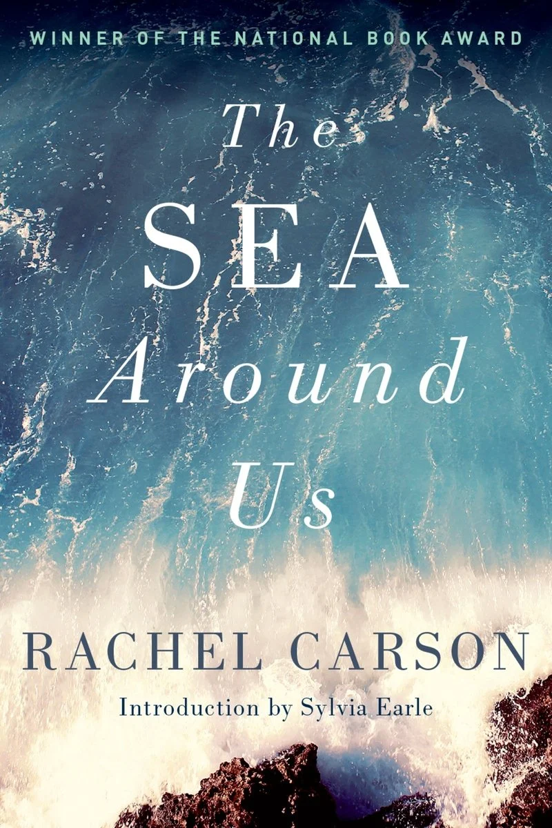 Book cover for "The Sea Around Us" by Rachel Carson, featuring ocean waves and the subtitle "Introduction by Sylvia Earle." Text notes it as a National Book Award winner.