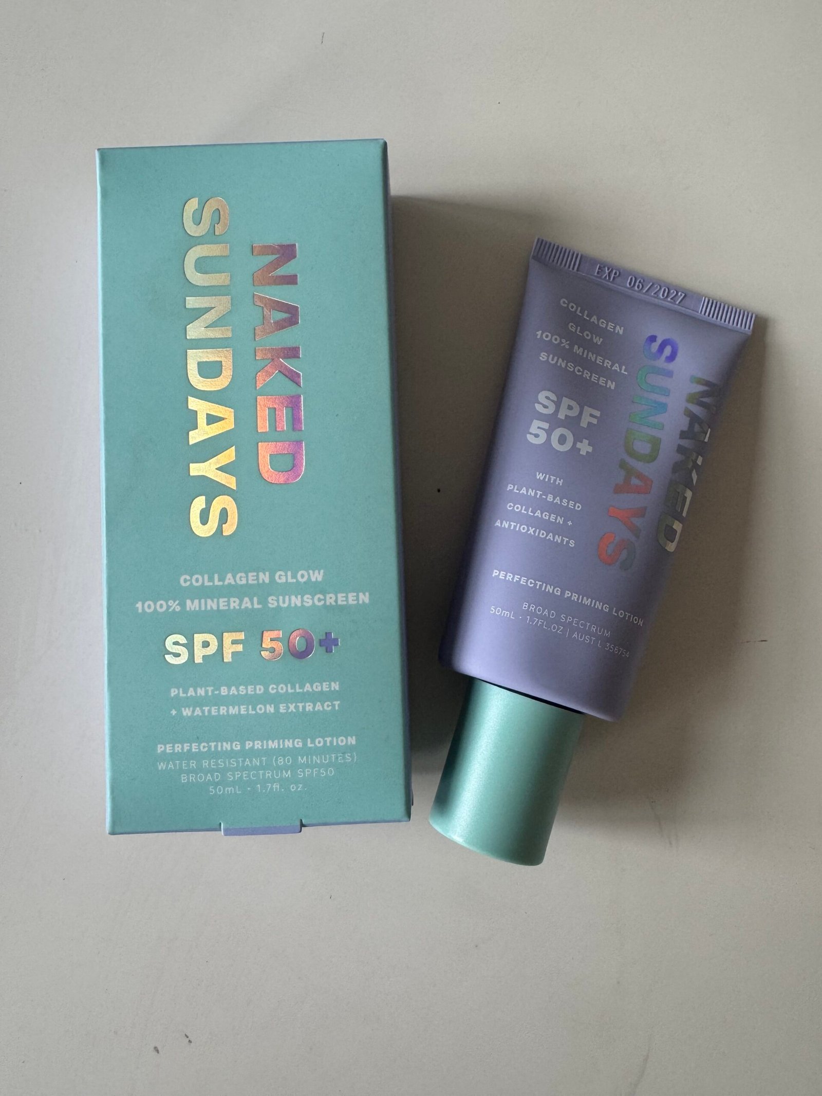 A box and tube of Naked Sundays Collagen Glow 100% Mineral Sunscreen SPF 50+, labeled as plant-based collagen with watermelon extract and antioxidants.