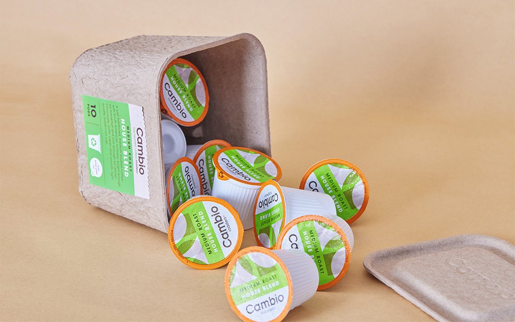 Sustainable molded pulp coffee packaging designed as a reusable container.