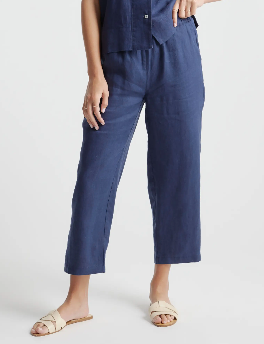 Blue linen pants on a model. 