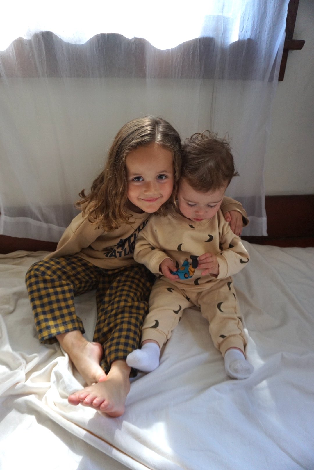 Two children wearing Organic Zoo clothing.