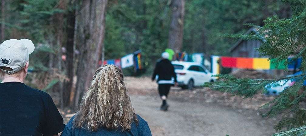 Enjoying a walk during an LGBTQ2SIA+ camping event, Pride, Lesbian Gay Bisexual Transgender Queer Two-spirited Intersex and Asexual +