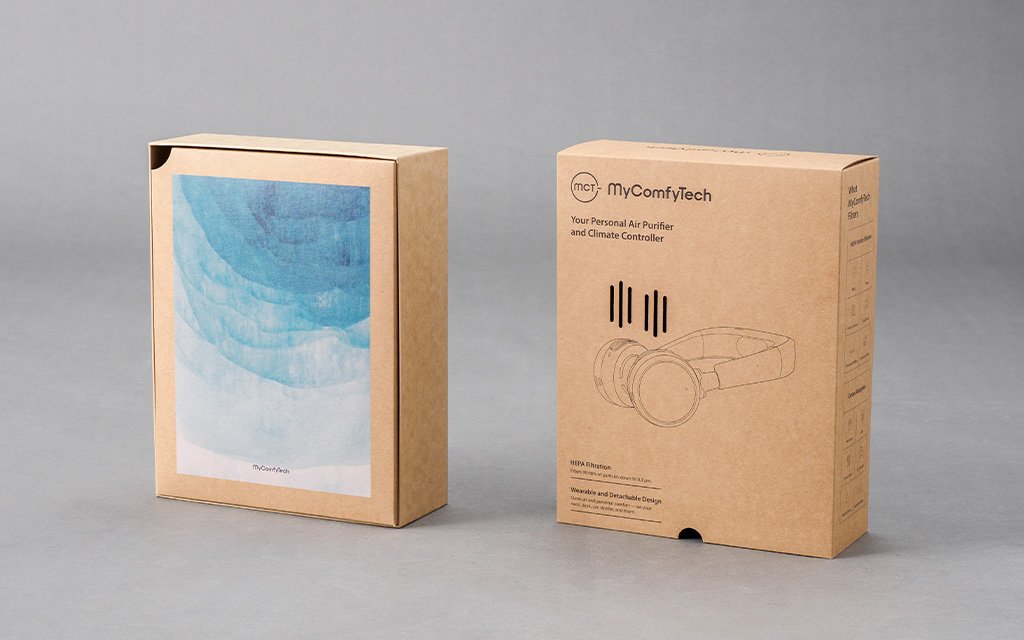A minimalist MyComyTech custom packaging box with simple branding.