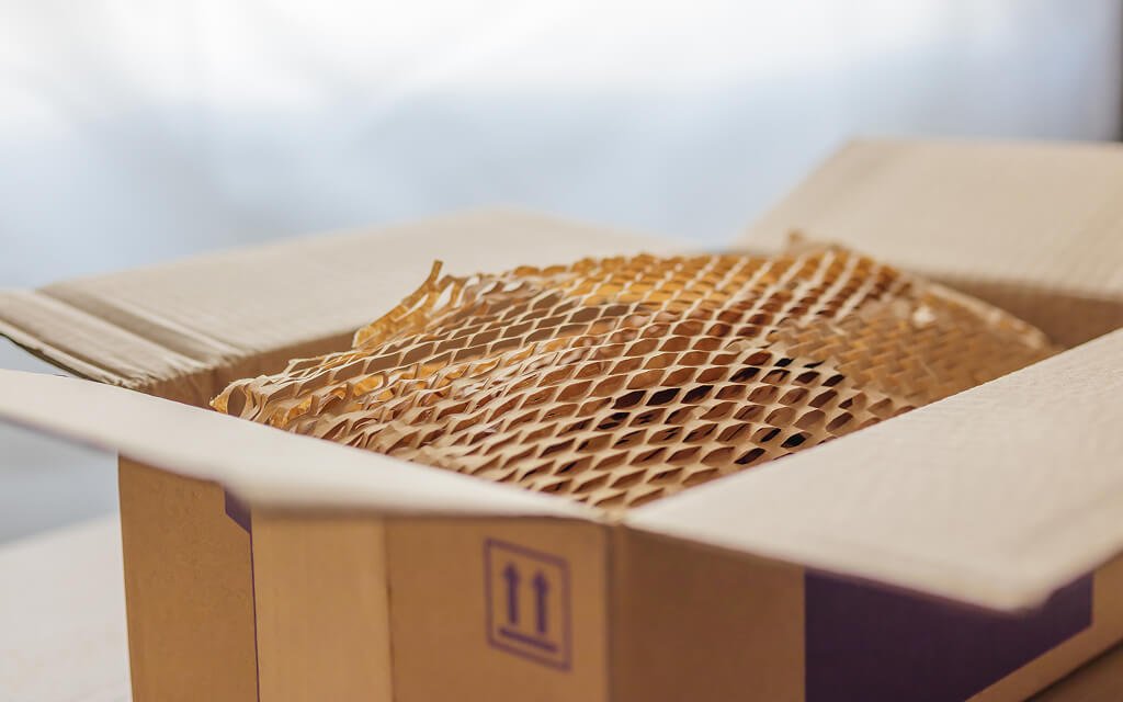 Brown honeycomb paper wrap used for protective packagin.