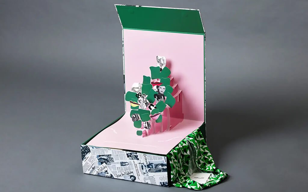 Custom layered pop-up packaging with engineered floating structure.