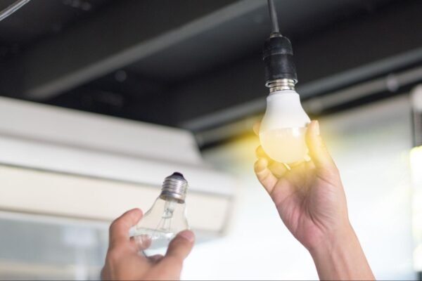 a person changing a lightbulb