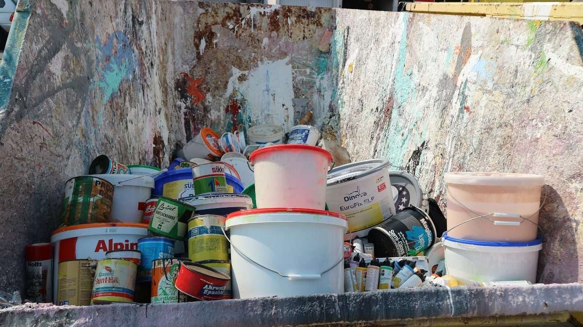Paint containers and aerosol cans collected at a recycling facility