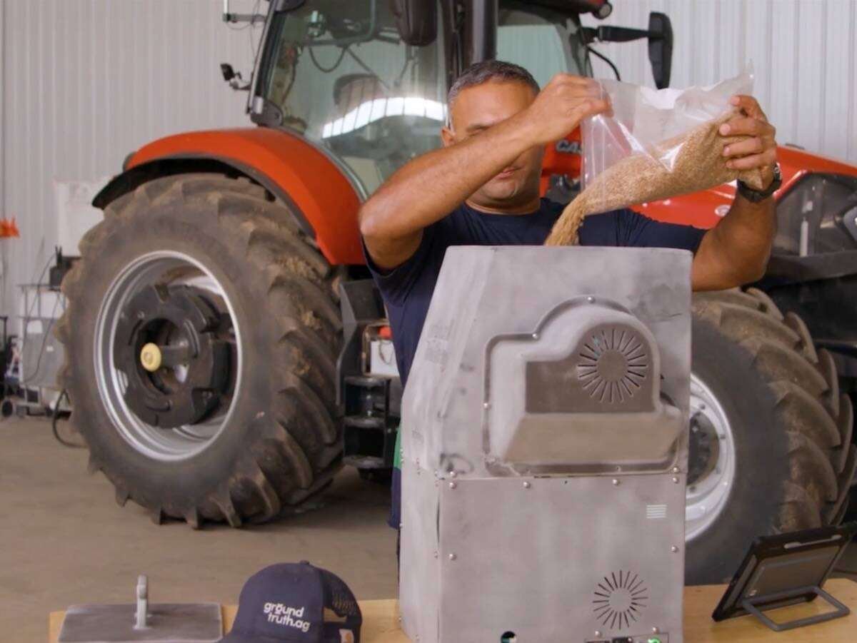 Divyesh Patel of Ground Truth Ag demonstrates the grain grading system. Photo: Saskatchewan Trade and Invest video screengrab via YouTube