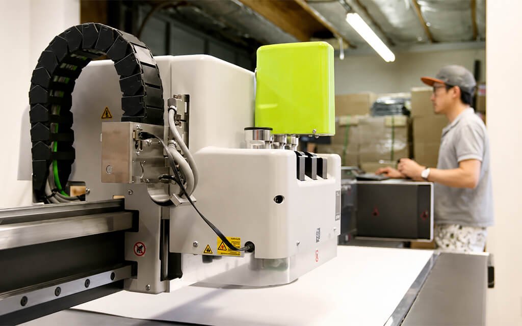 Zenpack design lab showing rapid prototyping equipment and packaging mockups