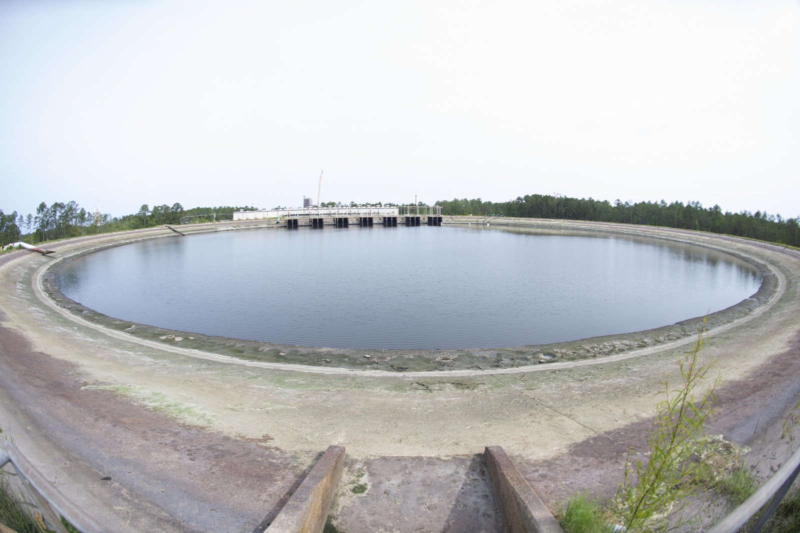 The reservoir at Stennis Space Center on May 11 shown at a dramatically lowered level, exposing large areas of the reservoir floor after 40 million gallons were pumped out.