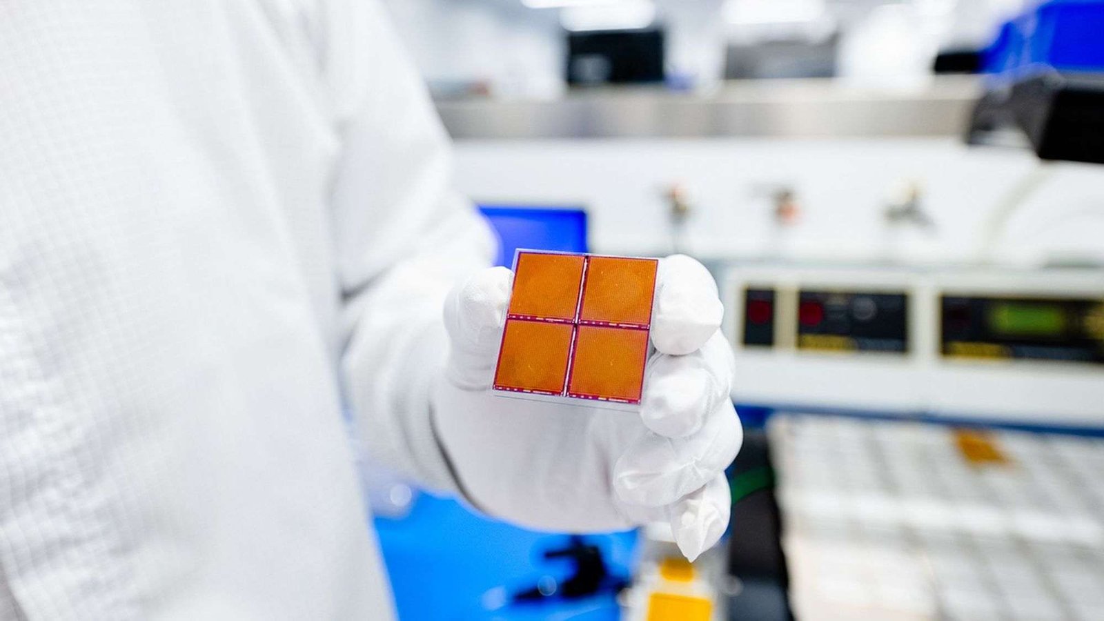 A gloved hand holds a detector square