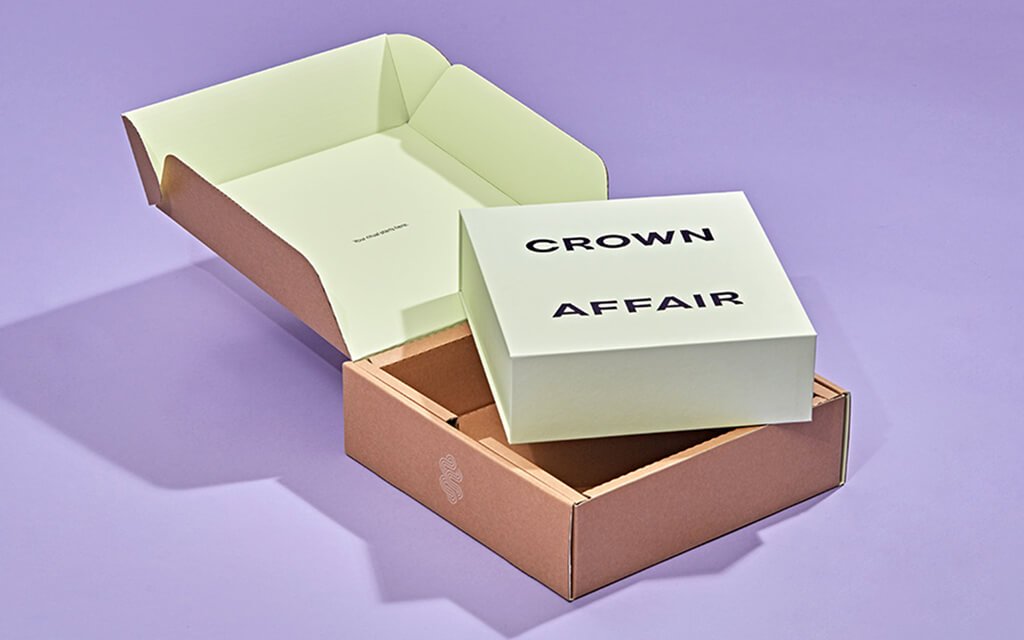 Zenpack sustainable custom packaging for Crown Affair haircare, with refined materials and unboxing design.