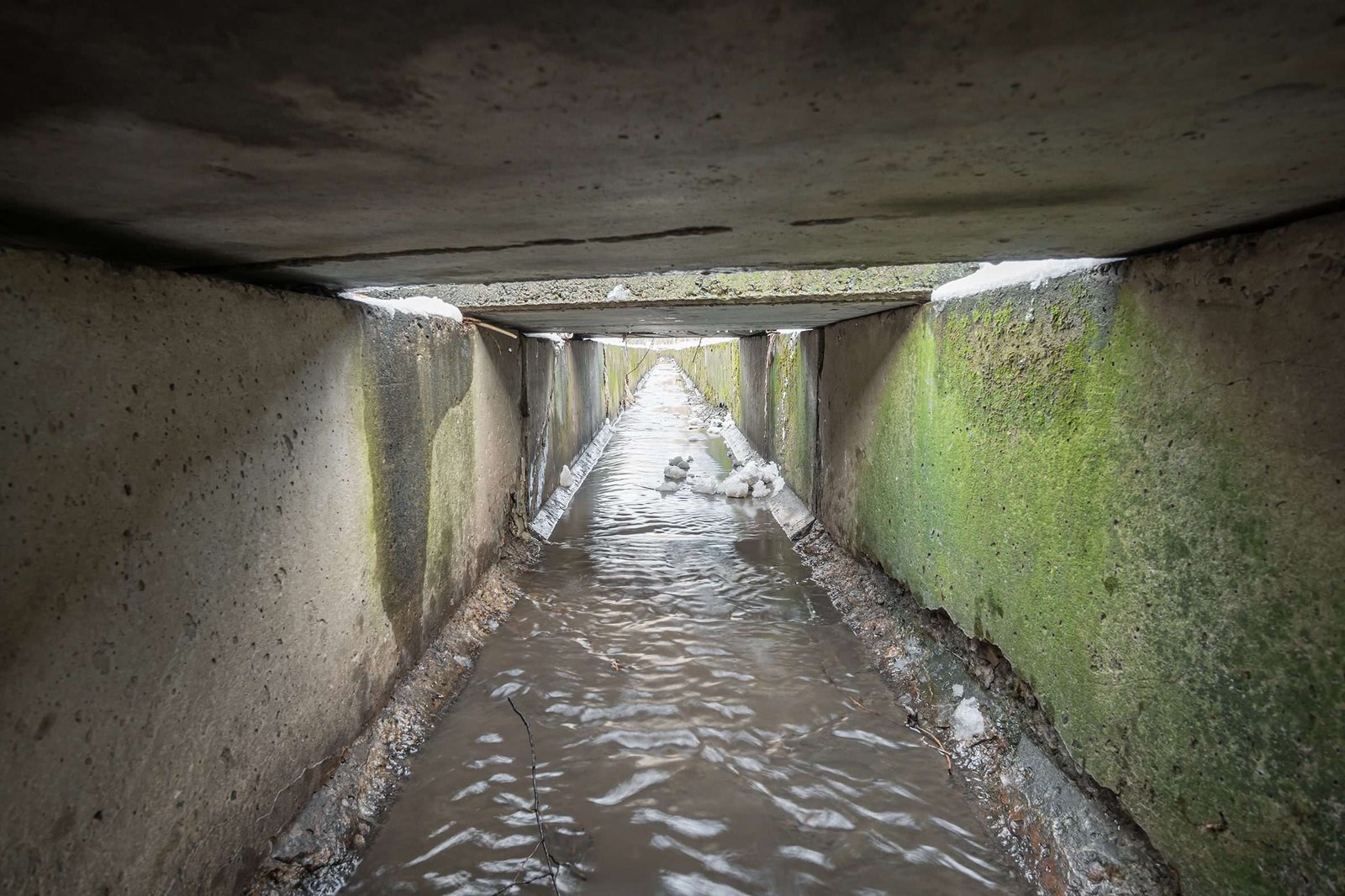 Concrete highway drainage culvert carrying stormwater