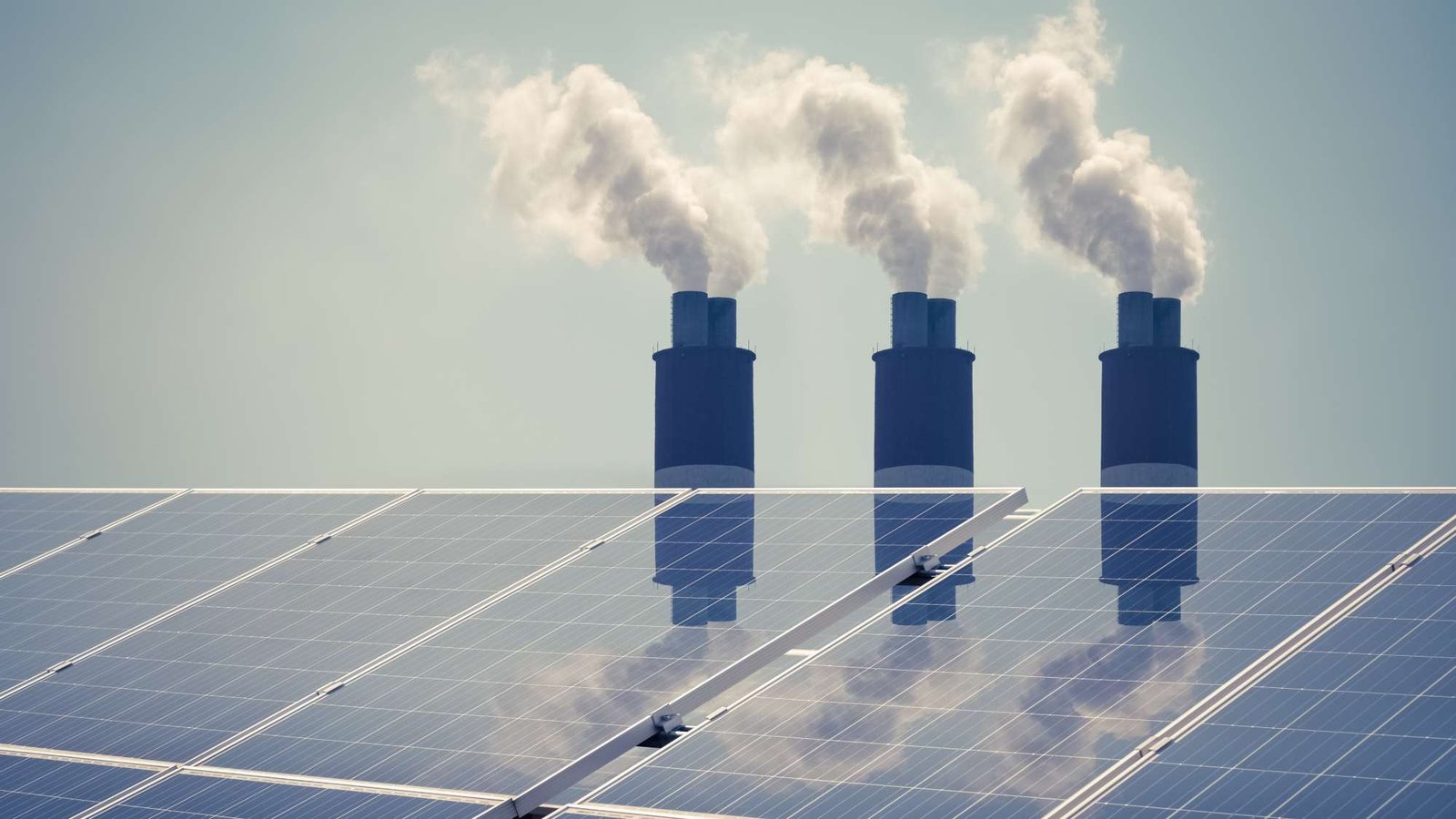 clean energy with pollution, roof solar panels reflected thermal power station exhaust steam