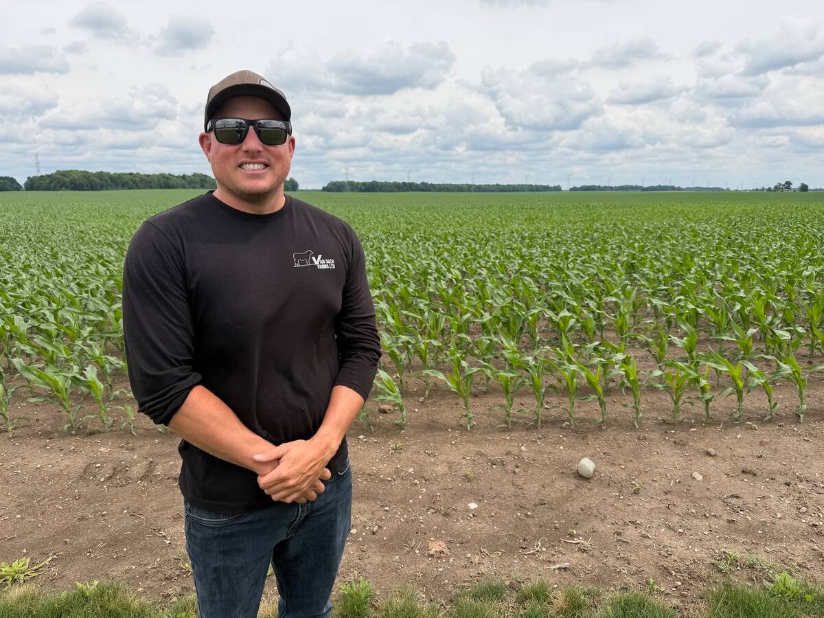 Kurt Van Osch stands in front of one of his farm’s corn fields. The crop and beef farm is working with CANZA to help fund some of its nitrogen management tests. Photo: John Greig