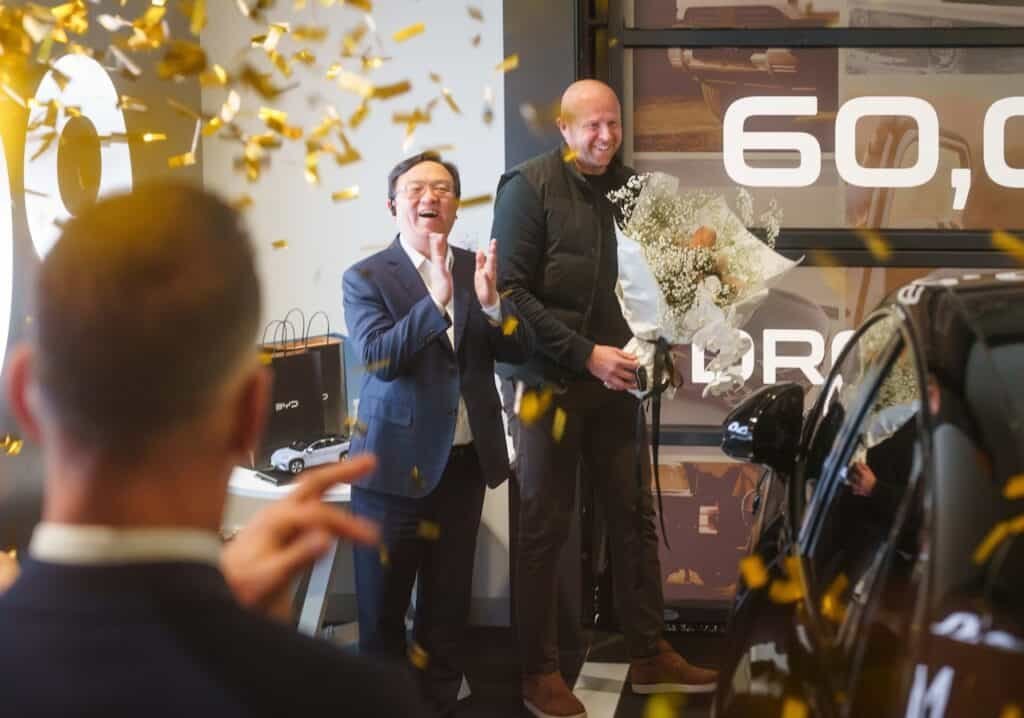 BYD founder and chairman Wang Chuanfu with 60,000th Australian BYD buyer Owain Norman.